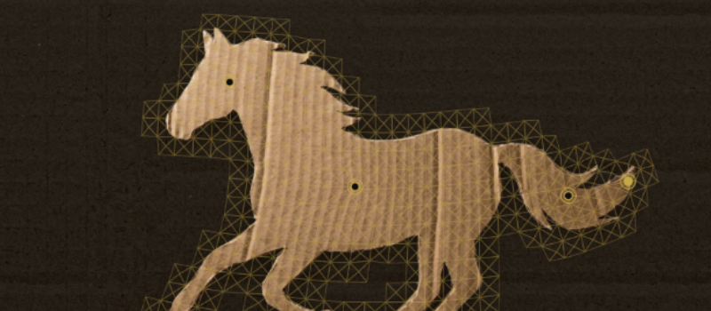 Cardboard horse cutout with a puppet deformation mesh overlaid