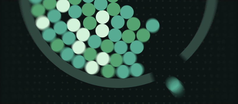 Simulated green circles piled inside a curved container